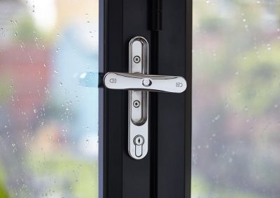 close up of bi fold door lock in chrome