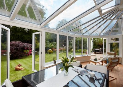 white upvc harmony lean to victorian conservatory opening out to the garden Matson4206